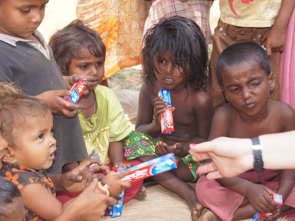 2013/March/Giving-Out-Colgate-To-Street-Kids.
