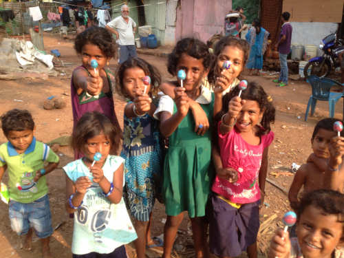 Children showing off the tasty imported lollipops!