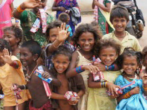 Bunch of Children Smiling with donations in Margao