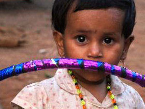 Young Girl with a freshly made, large Hula Hoop