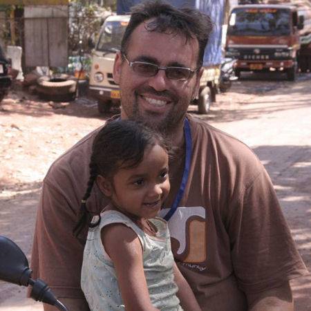 Robert with one of the children he has helped over the years in Goa